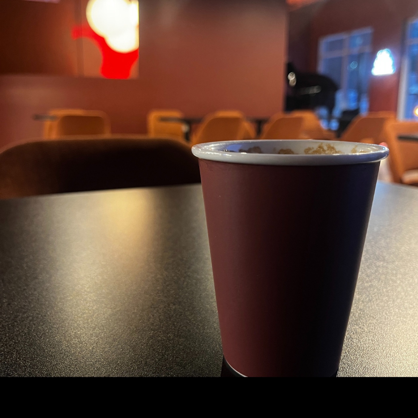 A warm drink on a table inside the lounge.