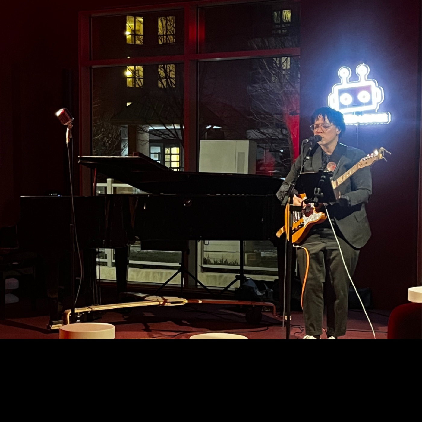 A guitarist performing on the Robo Lounge stage.