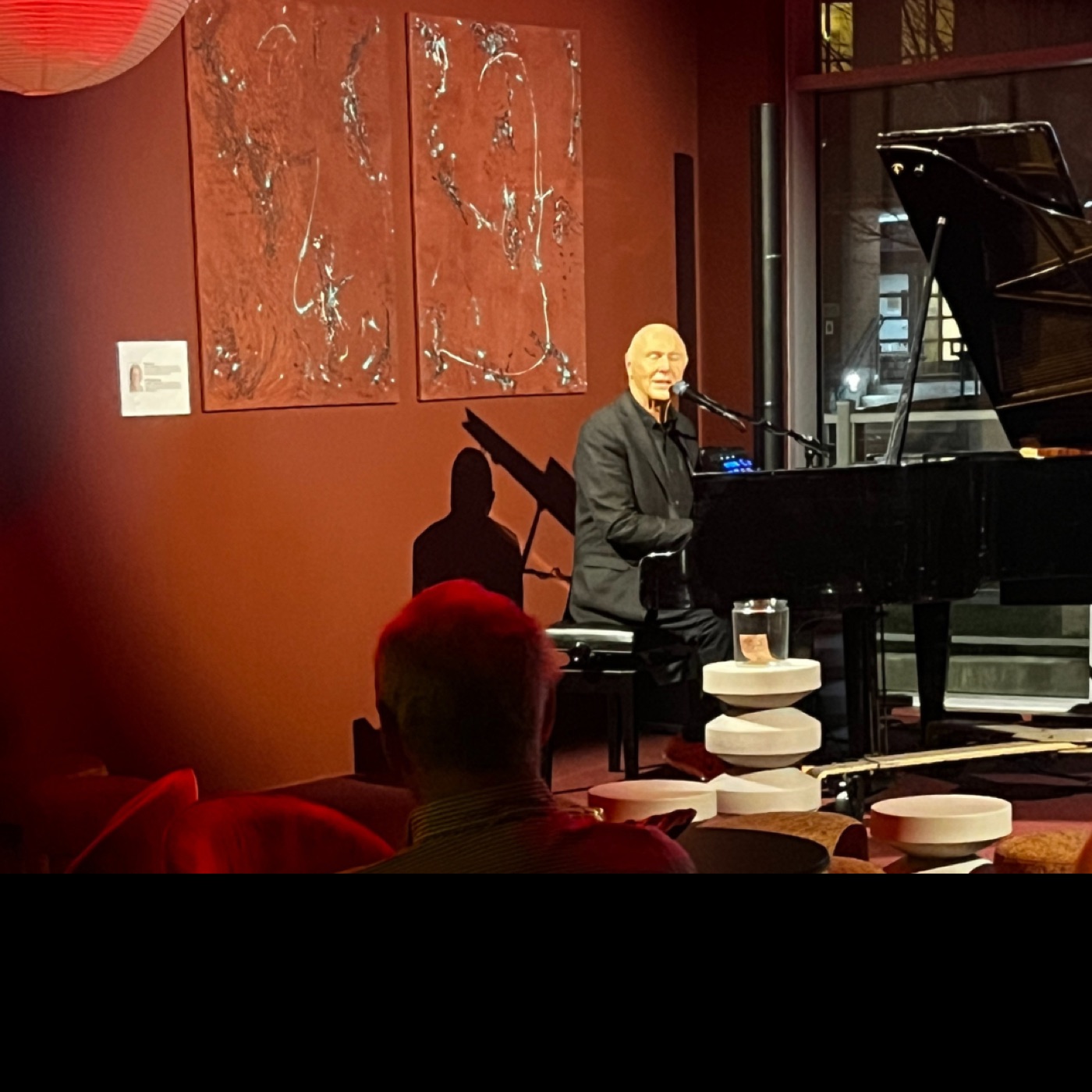 A pianist performing for a close audience.