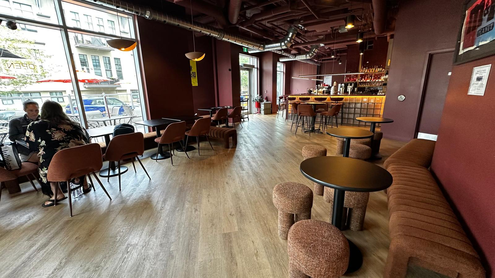 Lounge tables and upholstered seating beside the cafe and bar at The Robo Lounge.